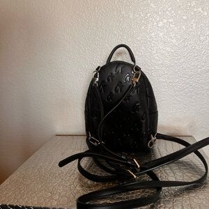 GLAMAHOLIC MINI MONOGRAM BACKPACK IN BLACK